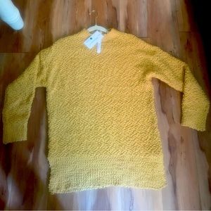 Merokeety loose, soft yellow poly sweater.
